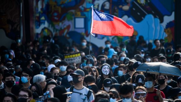 Pro-democracy protesters attend a rally, in the Tsim Sha Tsui area of Kowloon in Hong Kong on October 27, 2019. Police fired tear gas and rubber bullets October 27 at pro-democracy protesters who defied authorities to hold a rally on Hong Kong's scenic harbourfront, the latest flashpoint in months of political unrest gripping the city.  (Anthony WALLACE / AFP)