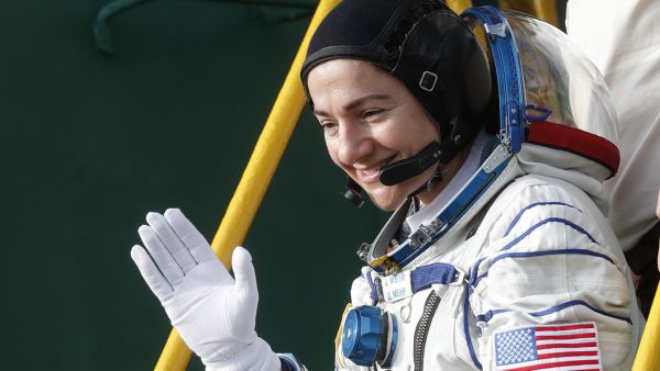 NASA's US astronaut Jessica Meir waves as she boards the Soyuz MS-15 spacecraft before its blasts off for the ISS, on September 25, 2019. (AFP/ File Photo)