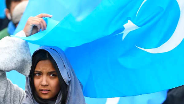 A woman takes part in a rally urging the European Union to pressure China to close its reeducation camps in Xinjiang, where nearly 1 million Uighur Muslims are detained. The rally was held in Brussels on April 27, 2018. Emmanuel Dunande/AFP via Getty Images
