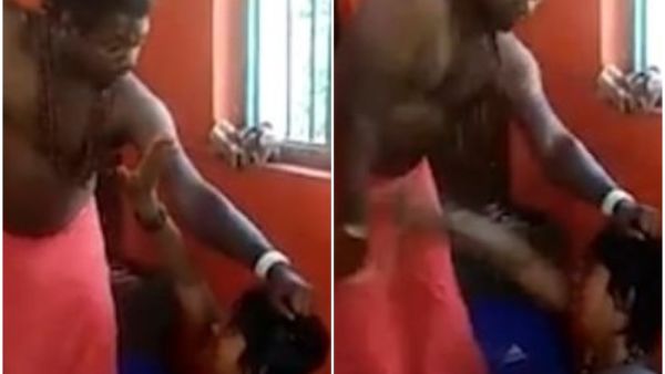 The priest then grabs the woman's hair as she kneels on the ground and starts to whip her as she screams and cries. (Video Screenshot/ Newslions)