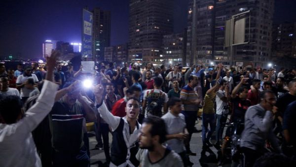 Egyptian protesters shout slogans as they take part in a protest in Cairo’s downtown on Friday calling for the removal of President Abdel Fattah Sisi. (AFP)