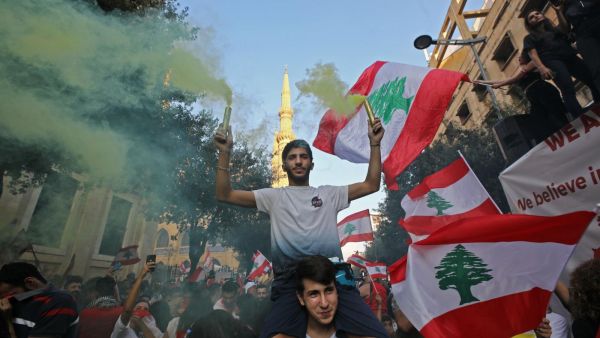 Lebanese protesters demand better living conditions and the removal of a cast of politicians who have monopolised power and influence for decades at Riad al-Solh Square in Beirut. (AFP)