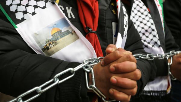 Palestinians protest against human rights center demanding action to save lives of Palestinian prisoners in Israeli jails. (Shutterstock/ File Photo)