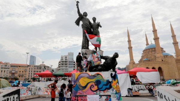 Muwatin Lebnene spontaneously emerged at the start of the protests to organize street clean-ups. (AFP)