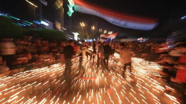 Iraqi protesters hold a candlelight vigil for victims killed during ongoing anti-government demonstrations in the Shiite shrine city of Karbala, south of Iraq's capital Baghdad, on November 2, 2019 Iraqi security forces clashed with anti-government protesters near the capital's Tahrir Square today as anti-government rallies which have rocked Baghdad for a month cost more lives. Mohammed SAWAF / AFP