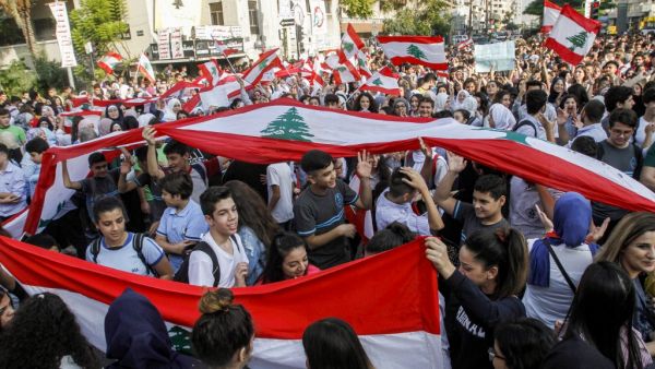 Lebanese students wave national flags and chant slogans as they gather in an anti-government demonstration in the southern city of Sidon (Saida) on November 6, 2019. (AFP/ File Photo)