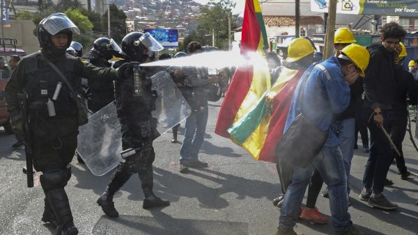 Riot police fire tear gas to disperse people taking part in a blockade to protest against the results of the October 20 elections in La Paz, on November 4, 2019. (AFP/ File Photo)