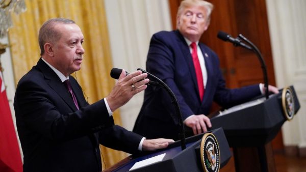US President Donald Trump and Turkey's President Recep Tayyip Erdogan (L) take part in a joint press conference in the East Room of the White House in Washington, DC on November 13, 2019. President Donald Trump greeted his Turkish counterpart Recep Tayyip Erdogan at the White House for a high-stakes meeting Wednesday that underlined his claim to be ignoring the impeachment drama unfolding simultaneously in Congress. MANDEL NGAN / AFP