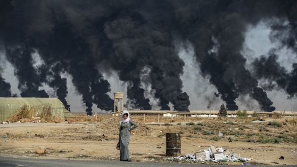 A woman stands along the side of a road on the outskirts of the town of Tal Tamr near the Syrian Kurdish town of Ras al-Ain along the border with Turkey in the northeastern Hassakeh province on October 16, 2019. (AFP/ File Photo) A woman stands along the side of a road on the outskirts of the town of Tal Tamr near the Syrian Kurdish town of Ras al-Ain along the border with Turkey in the northeastern Hassakeh province on October 16, 2019. (AFP/ File Photo)