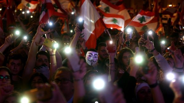 Lebanese demonstrators take part in a civilian Independence Day parade in Beirut's Martyr Square on November 22, 2019, more than a month into protests demanding an overhaul of the entire political system. (AFP/ File Photo)