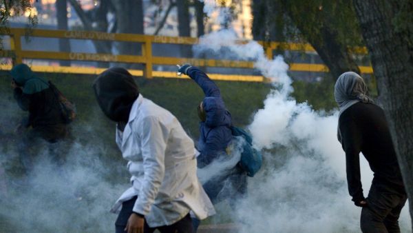 Demonstrators clash with riot police during a protest against the government of Colombian President Ivan Duque in Bogota on November 26, 2019. (AFP/ File Photo) Demonstrators clash with riot police during a protest against the government of Colombian President Ivan Duque in Bogota on November 26, 2019. (AFP/ File Photo)