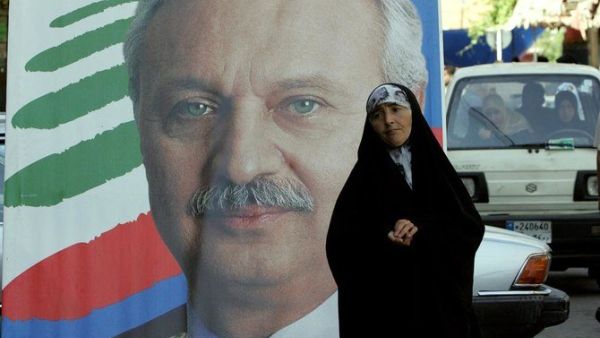 Former Lebanese finance minister Mohammed Safadi, pictured in poster, decided to withdraw following consultations with political parties. (AFP file)