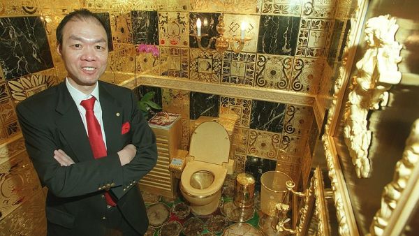 Winger Lam Sai-wing, a Hong Kong businessman, is pictured with his solid gold toilet in his office. The company chairman spent HK$38 million building the ultra-expensive washroom. (Daily Mail) Winger Lam Sai-wing, a Hong Kong businessman, is pictured with his solid gold toilet in his office. The company chairman spent HK$38 million building the ultra-expensive washroom. (Daily Mail)