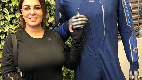'The space suit (pictured here with Ms Salim) just needs a little bit of a tweak. And it's just amazing, the excitement building up and the whole plan on how it's going to happen', the future astronaut told Yahoo Finance. (Twitter)