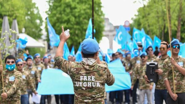 Ethnic Uyghurs take part in a protest march asking for the European Union to call upon China to respect human rights in the Chinese Xinjiang region and asking for the closure of "re-education centers." (AFP/ File Photo)