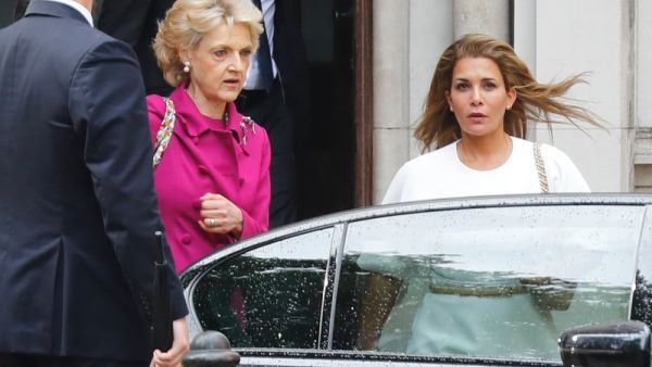 Princess Haya bint al-Hussein of Jordan (right), accompanied by her lawyer lawyer Fiona Shackleton (center), leaves the High Court in London on Tuesday. (Tolga Akmen/AFP/Getty Images)