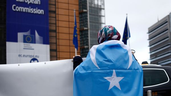 Activists protest the treatment of Uyghur Muslims by Chinese authorities in Xinjiang province at a protest outside the headquarters of the European Union. (Shutterstock/ File Photo)