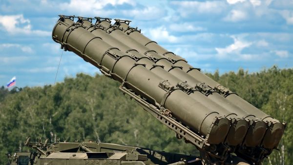 Russian army S-300 SA-10 Grumble mobile surface to air missile defense system launcher preparing to set launch position for missile container. (Shutterstock/ File Photo)