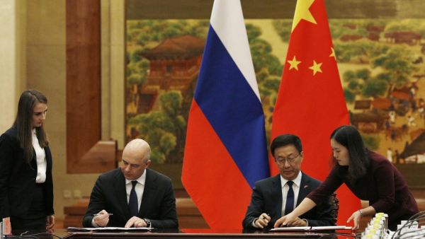 Russian First Deputy Prime Minister and Finance Minister Anton Siluanov attends a signing ceremony with Chinese Vice Premier Han Zheng at the Great Hall of the People in Beijing on November 26, 2019. FLORENCE LO / AFP