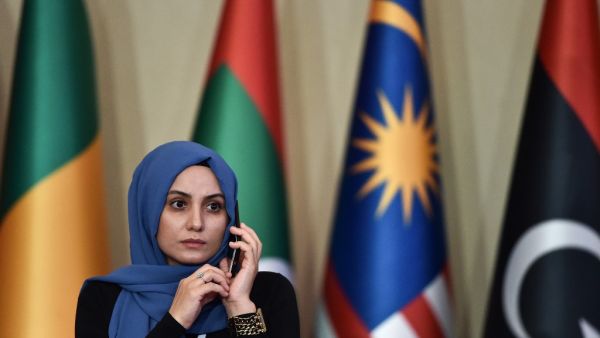 A woman speaks on the phone the opening ceremony of the 35th Ministerial Session of the Standing Committee for Economic and Commercial Cooperation of the Organization of Islamic Cooperation (COMCEC) on November 27, 2019 in Istanbul. Ozan KOSE / AFP