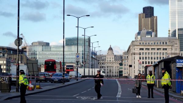 British police officers stand on duty at the southern entrance to London Bridge, leading to the City of London, on November 30, 2019, following the November 29 terror incident in which two people died after being stabbed on the bridge. (AFP/ File Photo)