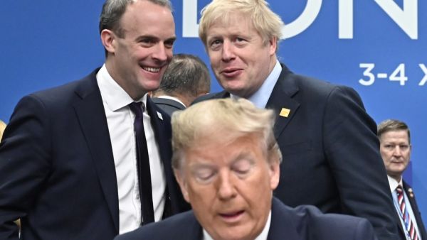 Britain's Foreign Secretary and First Secretary of State Dominic Raab (top L) and Britain's Prime Minister Boris Johnson talk by US President Donald Trump during the plenary session of the NATO summit at the Grove hotel in Watford, northeast of London on December 4, 2019. Tobias SCHWARZ / AFP