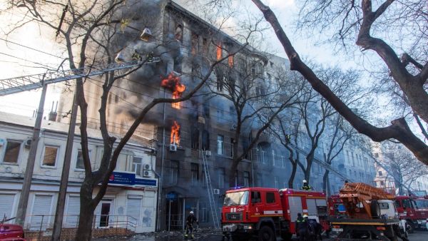 Firefighters extinguish a fire inside a college building in central Odessa on December 4, 2019. Ukrainian President Volodymyr Zelensky warned on December 5, 2019 that a deadly fire in the southern port city of Odessa could claim more victims, saying 14 people were still missing. Oleksandr GIMANOV / AFP