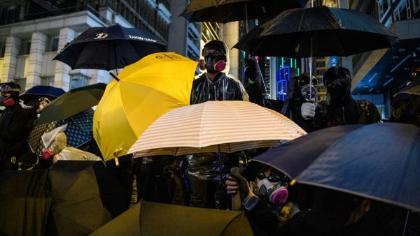 Protesters look on from Pedder Street in Central following a pro-democracy rally from Victoria Park to Chater Road in Hong Kong on December 8, 2019. (AFP/ File Photo)