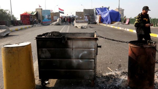Iraqis gather at al-Sinek bridge in the capital Baghdad amid ongoing anti-government protests on December 9, 2019. SABAH ARAR / AFP