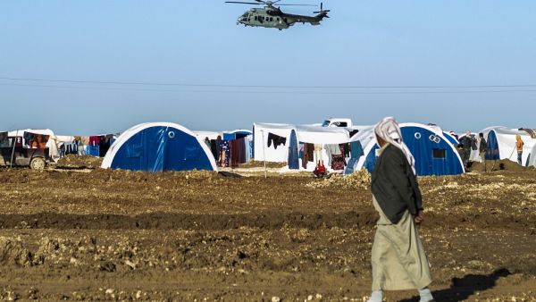  US-led military coalition in Syria over Washukanni camp which was recently established on the outskirts of Hasakeh city for people displaced from the northeastern Syrian town of Ras Al-Ain (AFP)