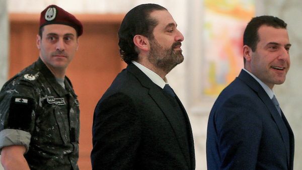 Lebanese caretaker Prime Minister Saad Hariri walks at the presidential palace in Baabda, east of Beirut, on December 19, 2019. AFP