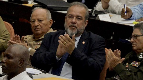 Newly appointed Cuban prime minister Manuel Marrero Cruz (C), attends the closing of the Fourth Regular Session of the National Assembly of Popular Power in its IX Legislature at the Convention Palace in Havana, on December 21, 2019. The National Assembly of Cuba appointed on Saturday the architect Manuel Marrero as Prime Minister of the island, the state press reported. YAMIL LAGE / AFP