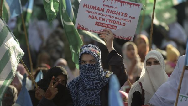 Women supporters of Pakistani political and Islamic party Jammat-e-Islami (JI), hold placards as they march during a protest in solidarity with Indian Kashmiri Muslims in Islamabad on December 22, 2019. Aamir QURESHI / AFP