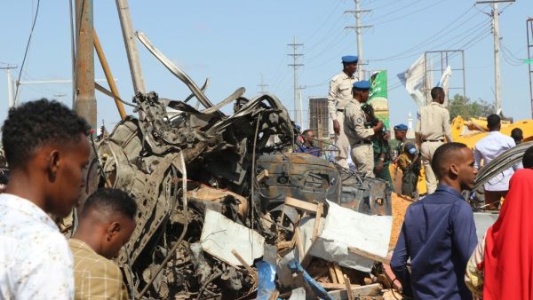 The wreckage of a car that was destroyed during the car bomb that exploded in Mogadishu that killed more than 20 people is photographed in Mogadishu on December 28, 2019. A massive car bomb exploded in a busy area of the Somali capital Mogadishu on December 28, 2019, leaving more than 20 people dead. Abdirazak Hussein FARAH / AFP