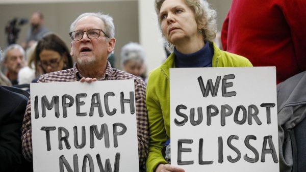 Don Woodward and his wife Carole Zak of Rochester, Michigan wait to listen to U.S. Representative Elissa Slotkin (D-MI) speak at a Town Hall meeting and discuss her decision to vote in favor of the impeachment of President Donald Trump on December 16, 2019 in Rochester, Michigan. (AFP/ File Photo)