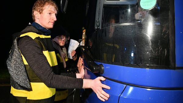 Extinction Rebellion protesters, some dressed as bees, walked towards the bus in the road as it left a visit to JCB in Uttoxeter, Staffordshire.  (AFP/ File Photo)