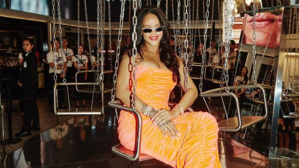 Rihanna's luxuriant dark tresses are down, and she wears a classic pop of red color on her lips (source: @badgalriri Instagram)