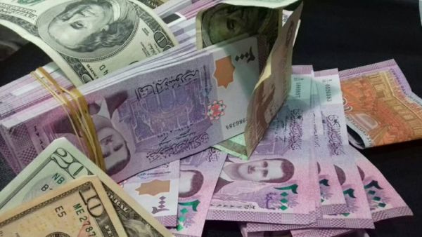 الأسد يصدر مرسوما تشريعيا يحدد عقوبة كل من يتعامل بغير الليرة السورية