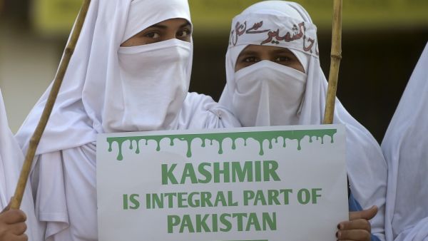 Women supporters of Pakistani political and Islamic party Jammat-e-Islami (JI), hold placards as they march during a protest in solidarity with Indian Kashmiri Muslims in Islamabad on December 22, 2019. Aamir QURESHI / AFP