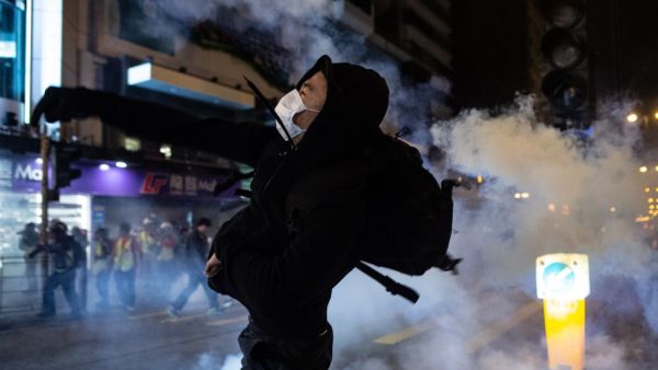 A protester reacts after police fire tear gas to disperse bystanders in a protest in Jordan district in Hong Kong, on early December 25, 2019. (AFP/ File Photo)