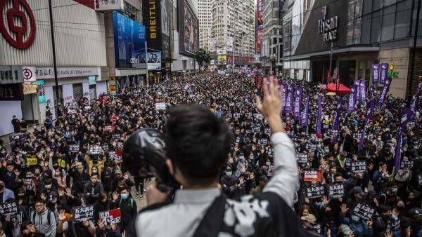 People take part in a pro-democracy march in Hong Kong on January 1, 2020. Tens of thousands of protesters marched in Hong Kong during a massive pro-democracy rally on New Year's Day, looking to carry the momentum of their movement into 2020.  ISAAC LAWRENCE / AFP