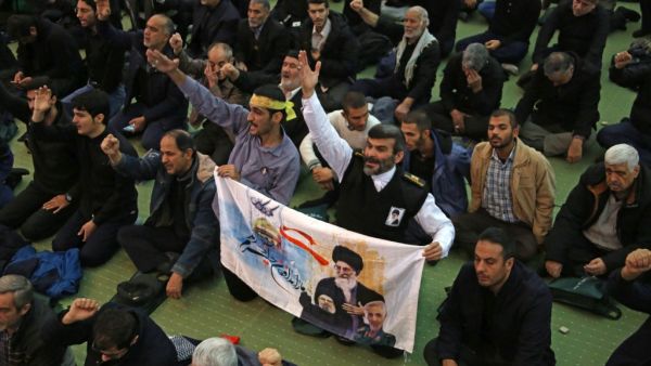 Iranian worshippers attend a mourning prayer for slain Iranian Revolutionary Guards Major General Qasem Soleimani in Iran's capital Tehran on January 3, 2020. Iran warned of "severe revenge" and said arch-enemy the United States bore responsiblity for the consequences after killing one of its top commanders, Qasem Soleimani, in a strike outside Baghdad airport. ATTA KENARE / AFP