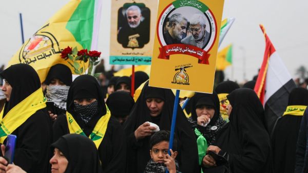 Supporters of the Hashed al-Shaabi paramilitary force and Iraq's Hezbollah brigades attend the funeral of Iranian military commander Qasem Soleimani (portrait) and Iraqi paramilitary chief Abu Mahdi al-Muhandis (portrait) in Baghdad's district of al-Jadriya, in Baghdad's high-security Green Zone, on January 4, 2020.(AFP/ File Photo)