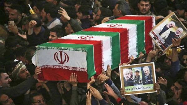 Mourners carry the coffins of slain Iraqi paramilitary chief Abu Mahdi al-Muhandis, Iranian military commander Qasem Soleimani and eight others inside the Shrine of Imam Hussein in the holy Iraqi city of Karbala,during a funeral procession on January 4, 2020. (AFP/ File Photo)