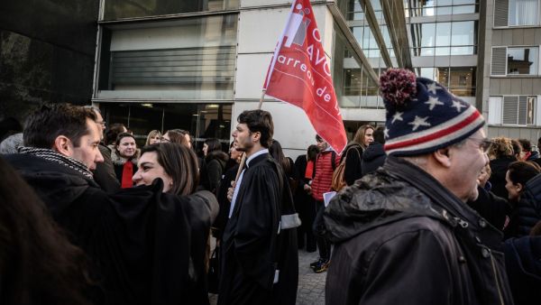 Lawyers take part in a demonstration against the French government's plan to overhaul the country's retirement system, on January 6, 2020 in Lyon, central eastern France. JEAN-PHILIPPE KSIAZEK / AFP