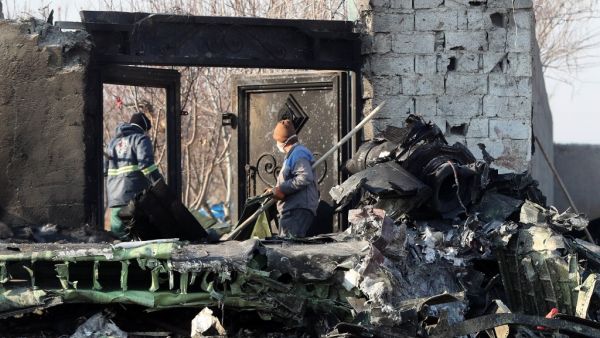 Rescue teams work amidst debris after a Ukrainian plane carrying 176 passengers crashed near Imam Khomeini airport in the Iranian capital Tehran early in the morning on January 8, 2020, killing everyone on board. The Boeing 737 had left Tehran's international airport bound for Kiev, semi-official news agency ISNA said, adding that 10 ambulances were sent to the crash site. AFP