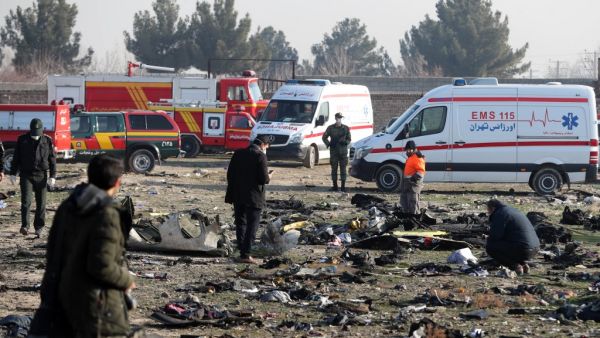 In this file photo taken on January 08, 2020, rescue teams work amidst debris after a Ukrainian plane carrying 176 passengers crashed near Imam Khomeini airport in the Iranian capital Tehran, killing everyone on board. AFP