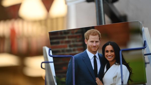 Royal memorabilia featuring Britain's Prince Harry, Duke of Sussex, and Meghan, Duchess of Sussex is displayed for sale in a store near Buckingham Palace in London on January 10, 2020. Prince Harry's wife Meghan has returned to Canada following the couple's bombshell announcement that they were quitting their frontline royal duties, it emerged Friday, as the monarch held urgent talks with her family to resolve the crisis. DANIEL LEAL-OLIVAS / AFP
