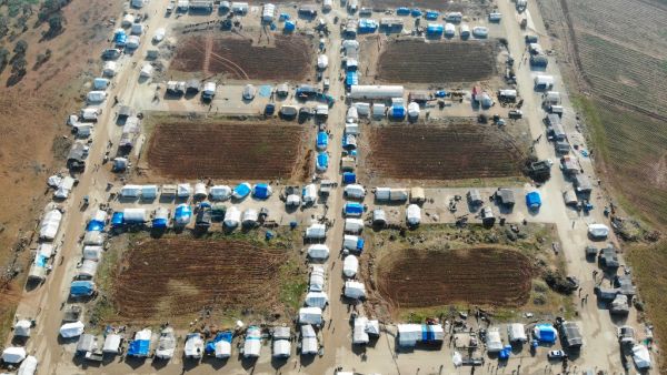 A drone picture taken on January 11, 2020, shows a camp for the displaced on the outskirts of the town of Binnish in Syria’s northwestern province of Idlib. Resident's of Syria's last major opposition bastion welcomed a UN vote renewing cross-border aid to the country, as relief groups condemned restrictions to the programme which is helping millions. The United Nations Security Council on Friday voted to extend humanitarian aid to Syria, including to some of the most needy in the northwestern region of Idl
