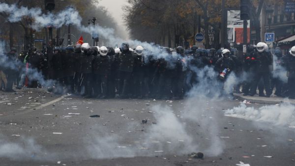  In this file photo taken on December 5, 2019, BRAV police brigades and French gendarmes stand in tear gas during a demonstration against the pension overhauls, in Paris. Zakaria ABDELKAFI / AFP